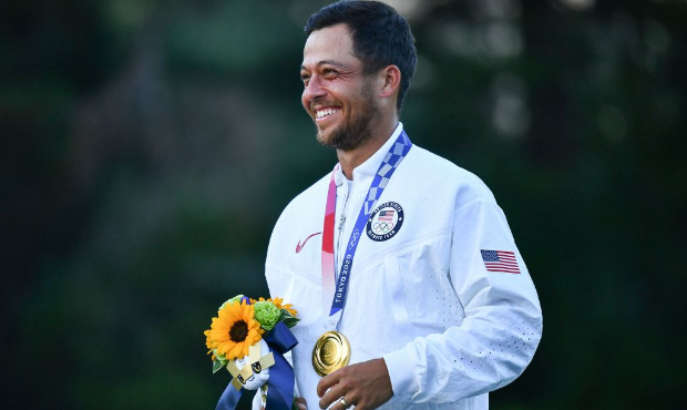 Gold medallist USA's Xander Schauffele stands on the podium at the medal ceremony of the mens golf ...