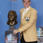 Alan Faneca, a member of the Pro Football Hall of Fame Class of 2021, poses with his bust during the induction ceremony at the Pro Football Hall of Fame, Sunday, Aug. 8, 2021, in Canton, Ohio. (AP Photo/Ron Schwane, Pool)