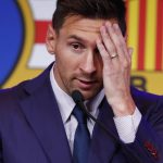 Lionel Messi gestures during a press conference at the Camp Nou stadium in Barcelona, Spain, Sunday, Aug. 8, 2021. FC Barcelona had previously announced the negotiations with Lionel Messi had ended and that Messi would be leaving the club. (AP Photo/Joan Monfort)