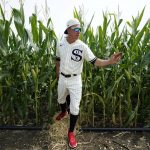 Chicago White Sox third baseman Jake Lamb walks through a cornfield before a baseball game against the New York Yankees, Thursday, Aug. 12, 2021, in Dyersville, Iowa. The Yankees and White Sox are playing at a temporary stadium in the middle of a cornfield at the Field of Dreams movie site, the first Major League Baseball game held in Iowa. (AP Photo/Charlie Neibergall)