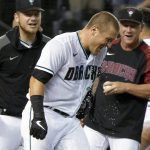 Water streams off Arizona Diamondbacks' Daulton Varsho (12) after he was showered with water at home plate after his game-winning solo home run against the San Diego Padres during the ninth inning of a baseball game Friday, Aug 13, 2021, in Phoenix. The Diamondbacks won 3-2. (AP Photo/Darryl Webb)
