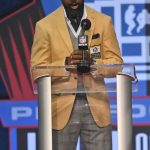 Charles Woodson, a member of the Pro Football Hall of Fame Class of 2021, speaks during the induction ceremony at the Pro Football Hall of Fame, Sunday, Aug. 8, 2021, in Canton, Ohio. (AP Photo/David Richard)