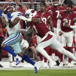 Dallas Cowboys wide receiver Ced Wilson can't make the catch as Arizona Cardinals running back Tavien Feaster (37) defends during the first half of an NFL preseason football game, Friday, Aug. 13, 2021, in Glendale, Ariz. (AP Photo/Rick Scuteri)