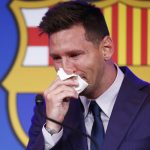 Lionel Messi cries at the start of a press conference at the Camp Nou stadium in Barcelona, Spain, Sunday, Aug. 8, 2021. FC Barcelona had previously announced the negotiations with Lionel Messi had ended and that Messi would be leaving the club. (AP Photo/Joan Monfort)