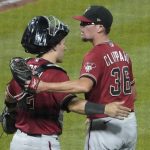 Arizona Diamondbacks relief pitcher Tyler Clippard greets catcher Daulton Varsho after the team's 5-2 win over the Pittsburgh Pirates in a baseball game Wednesday, Aug. 25, 2021, in Pittsburgh. (AP Photo/Keith Srakocic)