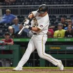 Pittsburgh Pirates' Yoshi Tsutsugo (32) hits a solo home run in the seventh inning of a baseball game against the Arizona Diamondbacks, Monday, Aug. 23, 2021, in Pittsburgh. (AP Photo/Keith Srakocic)
