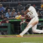 Pittsburgh Pirates' Ke'Bryan Hayes (13) drives in Kevin Newman with a ground out in the eighth inning of a baseball game against the Arizona Diamondbacks, Monday, Aug. 23, 2021, in Pittsburgh. The Pirates won 6-5. (AP Photo/Keith Srakocic)