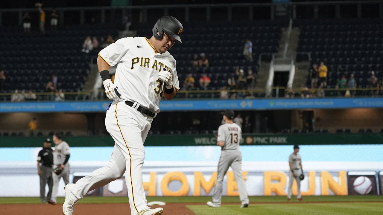 Pittsburgh Pirates' Yoshi Tsutsugo (32) rounds the bases after hitting a solo home run in the seven...