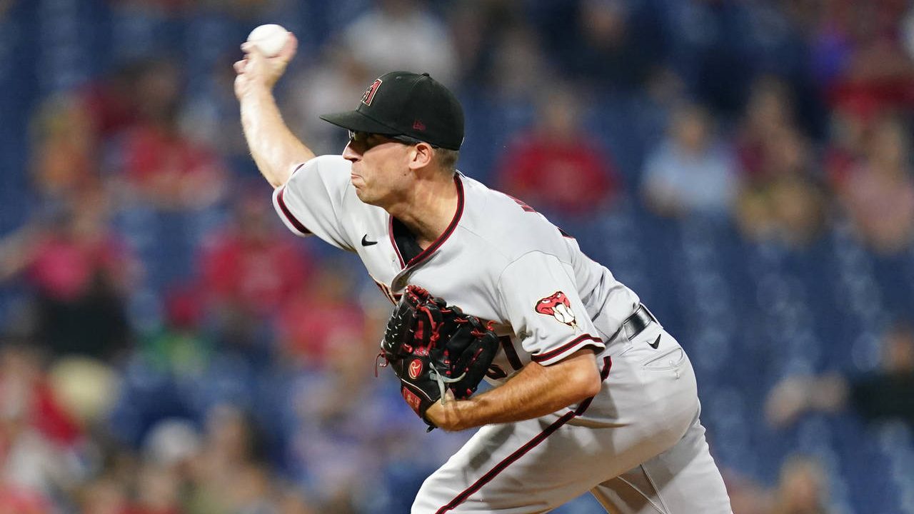 Arizona Diamondbacks' Taylor Widener pitches during the first inning of a baseball game against the...