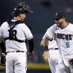 Arizona Diamondbacks left fielder David Peralta (6) celebrates with catcher Carson Kelly, left, after the final out of the team's baseball game against the San Francisco Giants, Tuesday, Aug. 3, 2021, in Phoenix. The Diamondbacks won 3-1. (AP Photo/Ross D. Franklin)