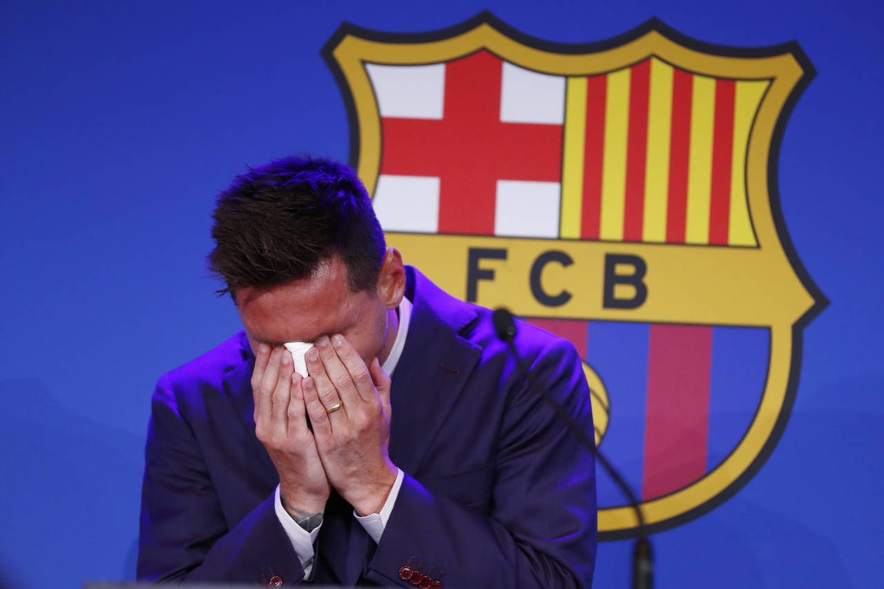 Lionel Messi cries at the start of a press conference at the Camp Nou stadium in Barcelona, Spain, ...