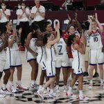 United States players celebrate their win in the women's basketball gold medal game against Japan at the 2020 Summer Olympics, Sunday, Aug. 8, 2021, in Saitama, Japan. (AP Photo/Luca Bruno)