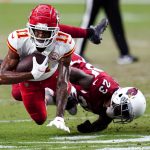Kansas City Chiefs wide receiver Demarcus Robinson (11) is tackled by Arizona Cardinals cornerback Robert Alford (23) during the first half of an NFL football game, Friday, Aug. 20, 2021, in Glendale, Ariz. (AP Photo/Ross D. Franklin)