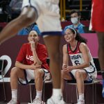 United States's Sue Bird (6), right, and teammate Diana Taurasi (12) watch from the bench during the women's basketball gold medal game against Japan at the 2020 Summer Olympics, Sunday, Aug. 8, 2021, in Saitama, Japan. (AP Photo/Eric Gay)