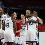 United States players celebrate after their win in the women's basketball gold medal game against Japan at the 2020 Summer Olympics, Sunday, Aug. 8, 2021, in Saitama, Japan. (AP Photo/Charlie Neibergall)
