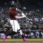 Arizona Diamondbacks' Ketel Marte hits a single against the Los Angeles Dodgers in the first inning during a baseball game, Sunday, Aug 1, 2021, in Phoenix. (AP Photo/Rick Scuteri)