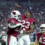 Arizona Cardinals running back Eno Benjamin celebrate his touchdown run with cornerback Robert Alford (23) during the first half of an NFL preseason football game against the Dallas Cowboys, Friday, Aug. 13, 2021, in Glendale, Ariz. (AP Photo/Ross D. Franklin)