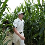 Chicago White Sox first baseman Andrew Vaughn walks through a cornfield before a baseball game against the New York Yankees, Thursday, Aug. 12, 2021, in Dyersville, Iowa. The Yankees and White Sox are playing at a temporary stadium in the middle of a cornfield at the Field of Dreams movie site, the first Major League Baseball game held in Iowa. (AP Photo/Charlie Neibergall)