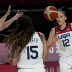 Japan's Himawari Akaho (88), left, passes past United States's Brittney Griner (15) and Diana Taurasi (12) during women's basketball gold medal game at the 2020 Summer Olympics, Sunday, Aug. 8, 2021, in Saitama, Japan. (AP Photo/Luca Bruno)