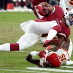 Arizona Cardinals running back James Conner is tackled by Kansas City Chiefs cornerback Charvarius Ward (35) during the first half of an NFL football game, Friday, Aug. 20, 2021, in Glendale, Ariz. (AP Photo/Rick Scuteri)