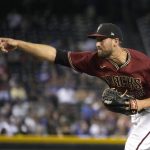 Arizona Diamondbacks relief pitcher Stefan Crichton throws against the Los Angeles Dodgers in the fifth inning during a baseball game, Sunday, Aug 1, 2021, in Phoenix. (AP Photo/Rick Scuteri)