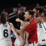 United States players hug each other to celebrate after their win in the women's basketball gold medal game against Japan at the 2020 Summer Olympics, Sunday, Aug. 8, 2021, in Saitama, Japan. (AP Photo/Eric Gay)