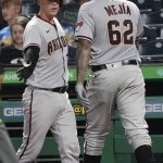 Arizona Diamondbacks' Humberto Mejia (62) is greeted by Carson Kelly after scoring on a hit by Ketel Martels in the fifth inning of a baseball game against the Pittsburgh Pirates, Monday, Aug. 23, 2021, in Pittsburgh. (AP Photo/Keith Srakocic)