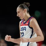 United States' Diana Taurasi (12) celebrates during women's basketball gold medal game against Japan at the 2020 Summer Olympics, Sunday, Aug. 8, 2021, in Saitama, Japan. (AP Photo/Charlie Neibergall)