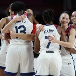 United States's Sue Bird (6), second right, and teammates hug each other to celebrate after their win in the women's basketball gold medal game against Japan at the 2020 Summer Olympics, Sunday, Aug. 8, 2021, in Saitama, Japan. (AP Photo/Charlie Neibergall)