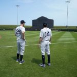 New York Yankees' DJ LeMahieu (26) and Tyler Wade (14) stand on the field before a baseball game against the Chicago White Sox, Thursday, Aug. 12, 2021, in Dyersville, Iowa. The Yankees and White Sox are playing at a temporary stadium in the middle of a cornfield at the Field of Dreams movie site, the first Major League Baseball game held in Iowa. (AP Photo/Charlie Neibergall)