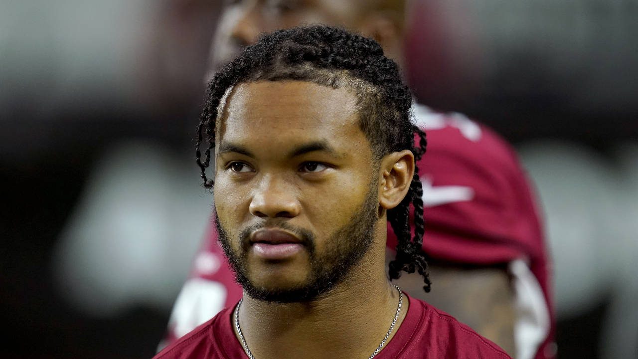 Arizona Cardinals quarterback Kyler Murray watches from the sidelines prior to an NFL preseason foo...