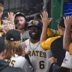 Pittsburgh Pirates' Anthony Alford (6) celebrates with teammates in the dugout after hitting a two-run home run against the Arizona Diamondbacks during the fourth inning of a baseball game Tuesday, Aug. 24, 2021, in Pittsburgh. (AP Photo/Keith Srakocic)