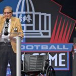 Tom Flores, a member of the Pro Football Hall of Fame Class of 2021, speaks during the induction ceremony at the Pro Football Hall of Fame, Sunday, Aug. 8, 2021, in Canton, Ohio. (AP Photo/David Richard)