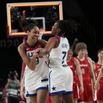 United States's A'Ja Wilson (9) and Ariel Atkins (7) celebrate after their win in the women's basketball gold medal game against Japan at the 2020 Summer Olympics, Sunday, Aug. 8, 2021, in Saitama, Japan.(AP Photo/Eric Gay)