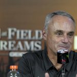 Commissioner Rob Manfred speaks during a news conference before a baseball game between the New York Yankees and Chicago White Sox, Thursday, Aug. 12, 2021 in Dyersville, Iowa. The Yankees and White Sox are playing at a temporary stadium in the middle of a cornfield at the Field of Dreams movie site, the first Major League Baseball game held in Iowa. (AP Photo/Charlie Neibergall)