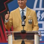 Peyton Manning, a member of the Pro Football Hall of Fame Class of 2021, gives a thumbs-up as he speaks during the induction ceremony at the Pro Football Hall of Fame, Sunday, Aug. 8, 2021, in Canton, Ohio. (AP Photo/David Richard)