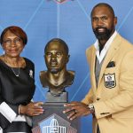 Charles Woodson, a member of the Pro Football Hall of Fame Class of 2021, right, poses with his presenter and mother, Georgia Woodson, during the induction ceremony at the Pro Football Hall of Fame, Sunday, Aug. 8, 2021, in Canton, Ohio. (AP Photo/Ron Schwane, Pool)