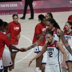 United States players celebrate during women's basketball gold medal game against Japan at the 2020 Summer Olympics, Sunday, Aug. 8, 2021, in Saitama, Japan. (AP Photo/Luca Bruno)