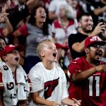 Arizona Cardinals fans cheer during the second half of an NFL football game against the Kansas City Chiefs, Friday, Aug. 20, 2021, in Glendale, Ariz. (AP Photo/Ross D. Franklin)
