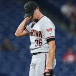 Arizona Diamondbacks pitcher Tyler Clippard reacts after giving up a two-run home run to Philadelphia Phillies' Brad Miller during the 10th inning of a baseball game, Friday, Aug. 27, 2021, in Philadelphia. (AP Photo/Matt Slocum)
