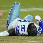 Dallas Cowboys defensive tackle Neville Gallimore (96) lies injured on the turf during the first half of an NFL preseason football game against the Arizona Cardinals, Friday, Aug. 13, 2021, in Glendale, Ariz. (AP Photo/Ross D. Franklin)