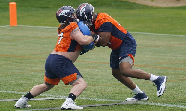 Denver Broncos guard Quinn Meinerz, left, squares off against tackle Ryan Pope during a drill at th...