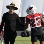 Cardinals head coach Kliff Kingsbury chats with CB Robert Alford during practice Wednesday, Sept. 15, 2021, in Tempe. (Tyler Drake/Arizona Sports)
