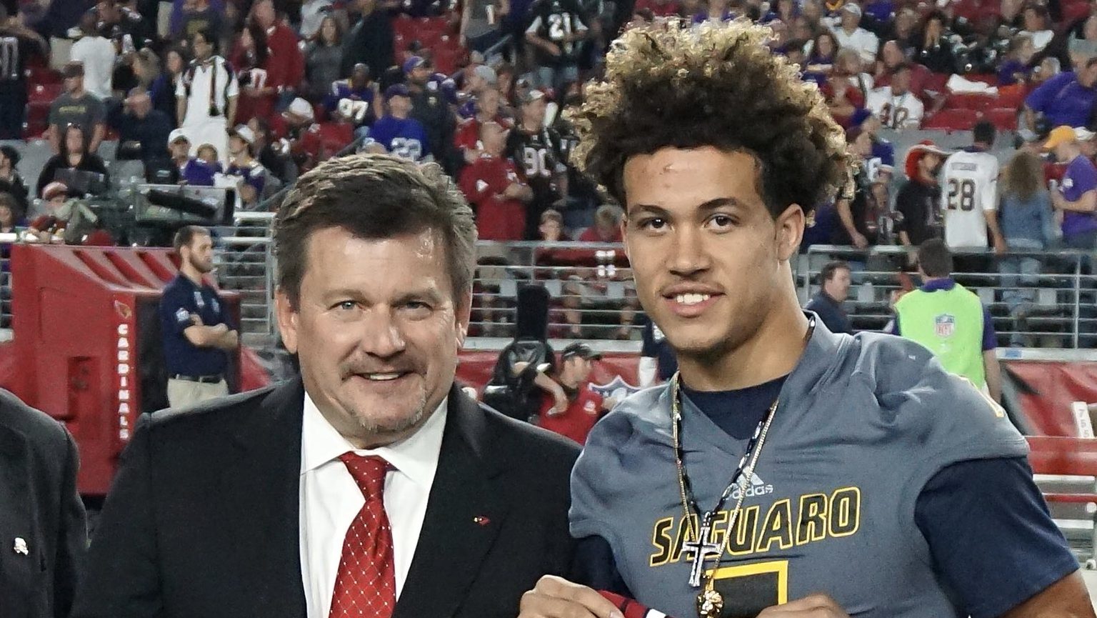 Byron Murphy being honored as Cardinals High School Player of the Year alongside owner Michael Bidw...