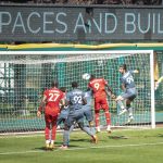 Phoenix Rising FC forward Darren Mattocks (#9) scores his second goal on a corner in a 3-1 win over Tacoma Defiance at Cheney Stadium on Sept. 5, 2021 in Tacoma, Washington. (Owain Evans Photo)