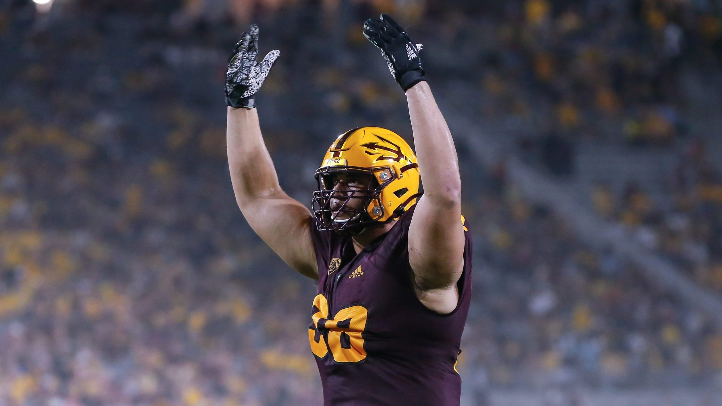 Arizona State Sun Devils defensive lineman D.J. Davidson (98) reacts to a big play during the colle...
