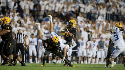 Rachaad White #3 of the Arizona State Sun Devils up ends Keenan Pili $41of the BYU Cougars as he pr...