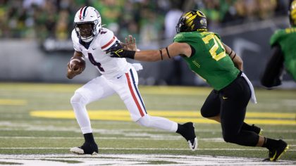 EUGENE, OR - SEPTEMBER 25: Jordan McCloud #4 of the Arizona Wildcats runs with the ball against the...