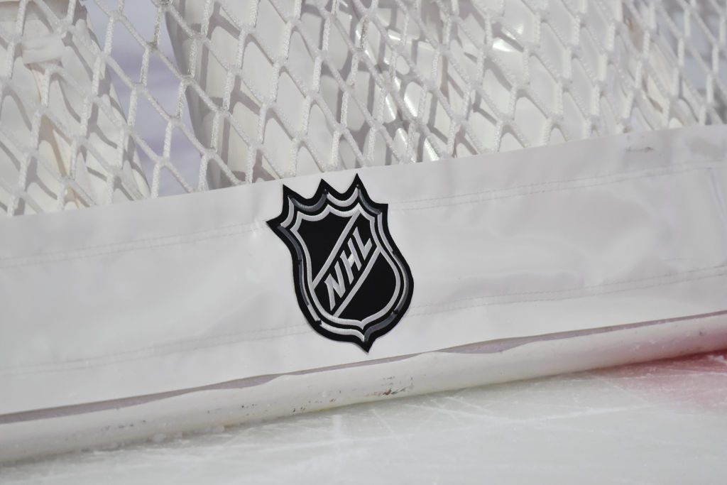 The NHL logo displayed behind a hockey net during intermission between the Montreal Canadiens and t...