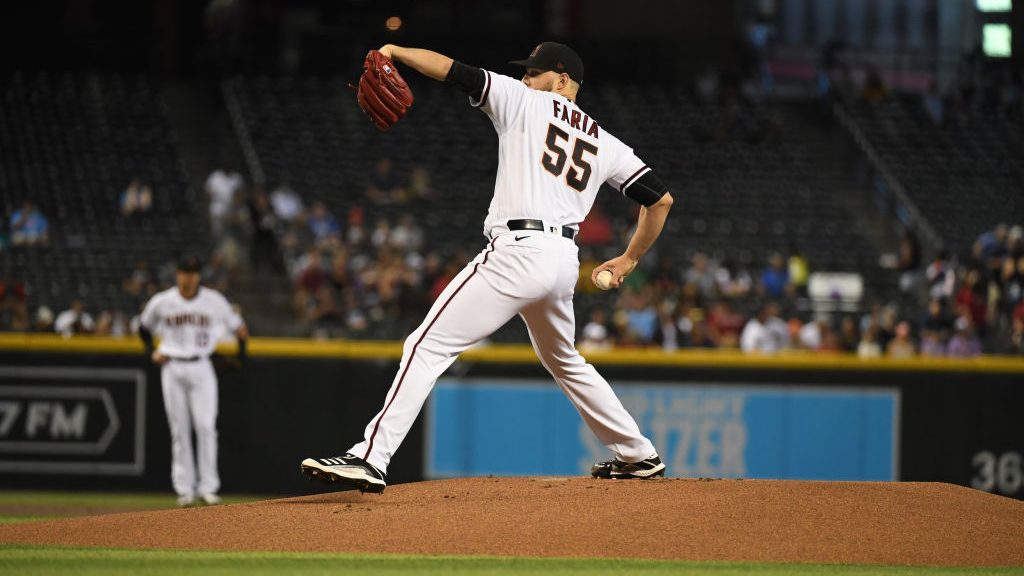 Jake Faria #55 of the Arizona Diamondbacks delivers a pitch against the Colorado Rockies at Chase F...